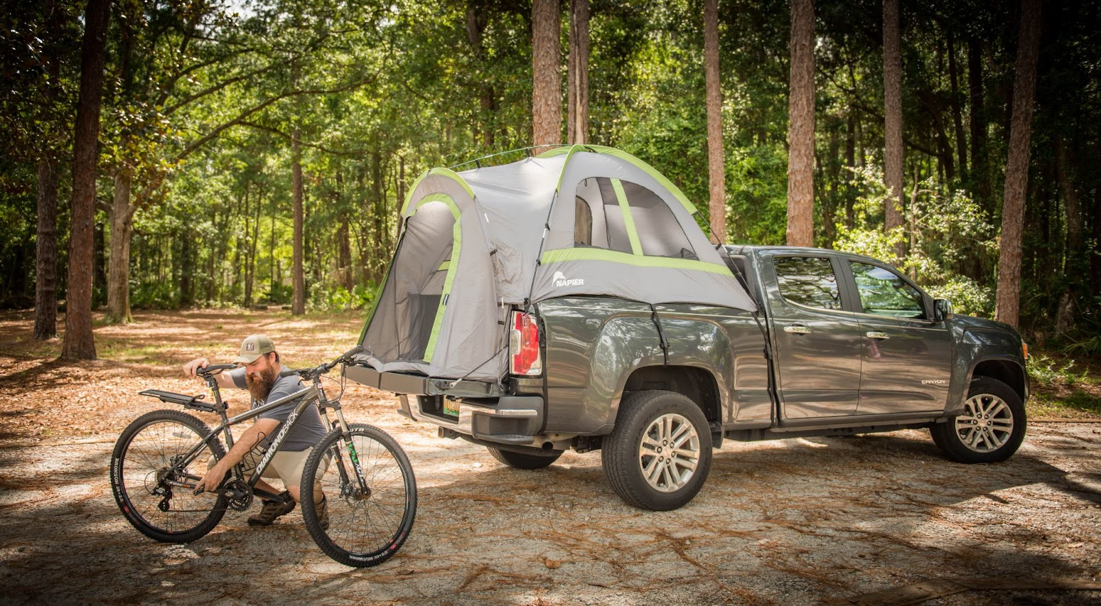 What are truck bed tents? Sportz tent is seen parked at a campsite with a deer