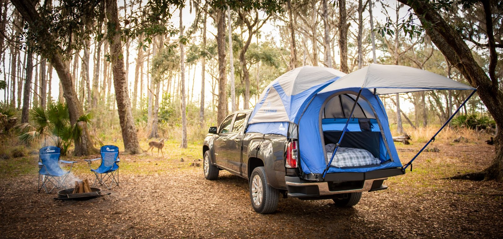 What are truck bed tents? Sportz tent is seen parked at a campsite with a deer
